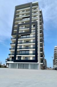 a tall apartment building on the beach at Studio Katerina in Mamaia