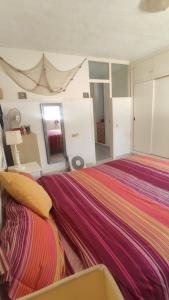 A bed or beds in a room at Mi morena cala llobeta 35