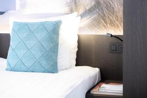 Voodi või voodid majutusasutuse Hotel Nelson toas