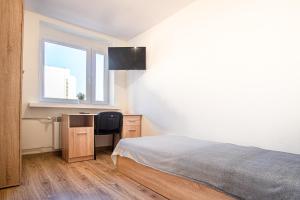 Ένα ή περισσότερα κρεβάτια σε δωμάτιο στο Dream Aparts - 10 Lutego