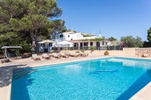 a swimming pool with a dolphin in the water at Ca na Lidia d’en Carlos in La Mola