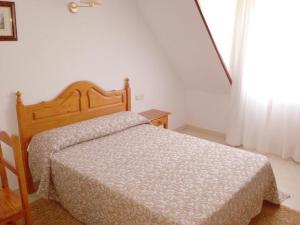 Łóżko lub łóżka w pokoju w obiekcie Hotel Casa Portuguesa