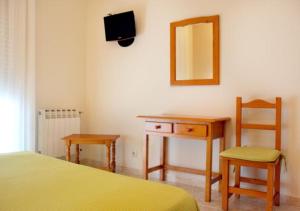 Łóżko lub łóżka w pokoju w obiekcie Hotel Casa Portuguesa
