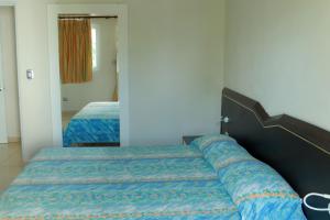 Postel nebo postele na pokoji v ubytování Kitewind Apartamentos Cabarete