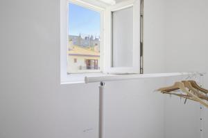 a window with a view of a building at Studio Gaston - Welkeys in Biarritz