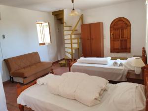 A bed or beds in a room at Stoupa Mani Tower