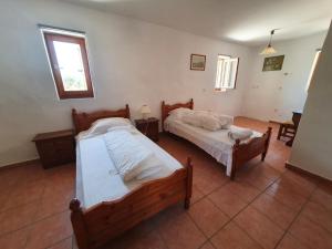 A bed or beds in a room at Stoupa Mani Tower