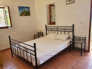 A bed or beds in a room at Stoupa Mani Tower