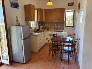 A kitchen or kitchenette at Stoupa Mani Tower
