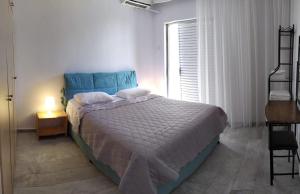 A bed or beds in a room at Luca Apartments