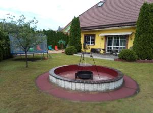 a fire pit in the middle of a yard at Willa u Andrzeja in Gołdap