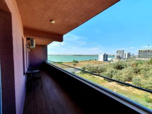 a balcony with a view of the ocean at Apartament Criss Lotus in Mamaia
