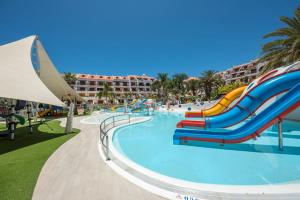 a water slide in a pool at a resort at Parque Santiago 3 Luxery Apartment, Playa las Américas, Arona, Tenerife in Playa de las Americas