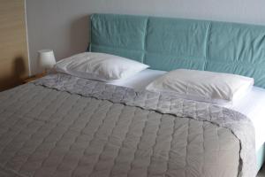 A bed or beds in a room at Luca Apartments