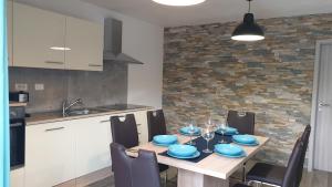 a kitchen with a table with blue dishes on it at Apartma Claudia in Pivka