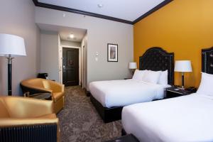 Rúm í herbergi á Hotel Clarendon