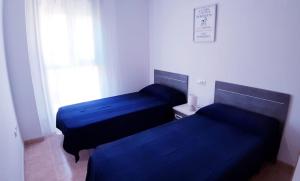 Postel nebo postele na pokoji v ubytování Acrópolis Vidaber