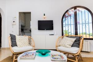 a living room with two chairs and a table at Villa Casa Vincella in Balcon del Mar