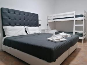 Posteľ alebo postele v izbe v ubytovaní B&B Il Viaggiatore