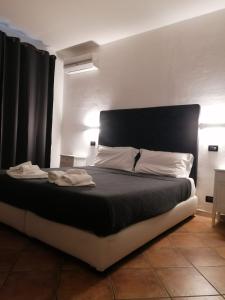 Posteľ alebo postele v izbe v ubytovaní B&B Il Viaggiatore