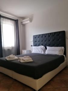 Posteľ alebo postele v izbe v ubytovaní B&B Il Viaggiatore
