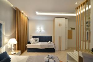 Posteľ alebo postele v izbe v ubytovaní Epavlis Luxury apts