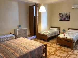 Postel nebo postele na pokoji v ubytování Dimora del Sole