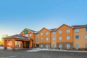a rendering of a hotel with a parking lot at La Quinta Inn & Suites Casino and Bar by Wyndham Glendive in Glendive