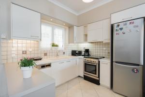 Kuchyň nebo kuchyňský kout v ubytování Luna Apartments