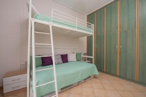 Postel nebo postele na pokoji v ubytování Luna Apartments