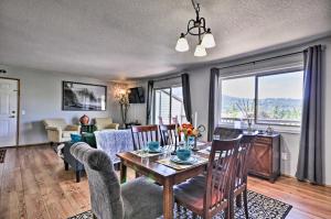 a dining room with a table and chairs and a living room at Classy Hood River Condo with Mt Adams Views! in Hood River