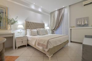 Posteľ alebo postele v izbe v ubytovaní Epavlis Luxury apts
