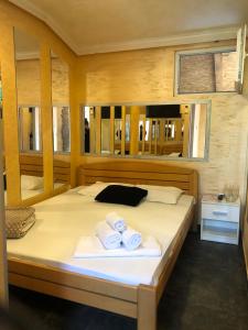 a bedroom with a bed with towels on it at Spa Secret in Belgrade