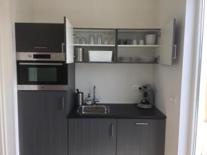 Kuchyň nebo kuchyňský kout v ubytování Luxury Lodge Veere