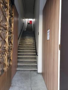 a staircase in a building with stairs leading down at Hotel Brás in São Paulo +10 photos