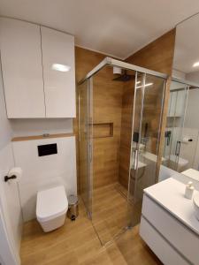 Kúpeľňa v ubytovaní Baltic Blue Apartament + 27 fotografií