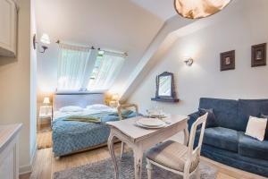 Posteľ alebo postele v izbe v ubytovaní Apartamenty Kurort