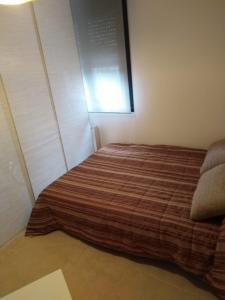 a bedroom with a bed and a window at DavidSara in Llanes +16 photos