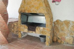 Televízia a/alebo spoločenská miestnosť v ubytovaní Villa Capricho de Luna