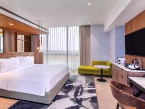 Postelja oz. postelje v sobi nastanitve Mercure Tangerang BSD City