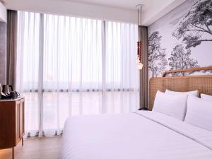 Postelja oz. postelje v sobi nastanitve Mercure Tangerang BSD City