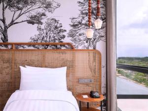 Postelja oz. postelje v sobi nastanitve Mercure Tangerang BSD City