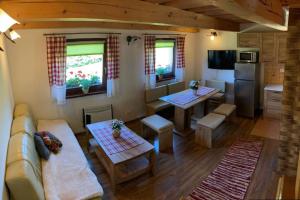 a living room with a couch and a table at Domček u Fera in Zázrivá