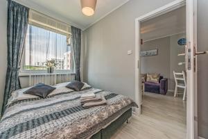 Posteľ alebo postele v izbe v ubytovaní Apartament LUX