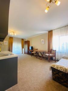 a large room with a kitchen and a living room at Villa Park 411 in Odesa