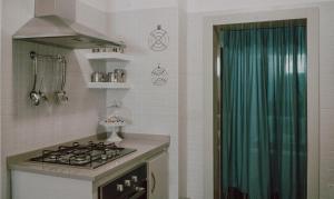 Virtuve vai virtuves zona naktsmītnē Via Colombo Apartment
