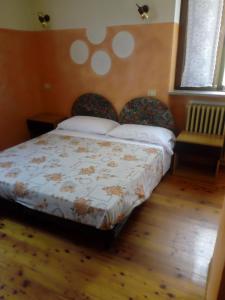 Postel nebo postele na pokoji v ubytování Albergo Bar Brenve