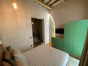Postel nebo postele na pokoji v ubytování Il cortile di Elen