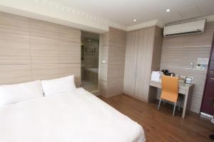 A bed or beds in a room at Sea Keelung 61