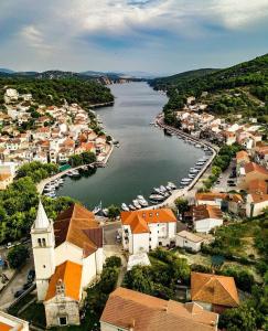 an aerial view of a town next to a river at Apartment Antić in Zaton